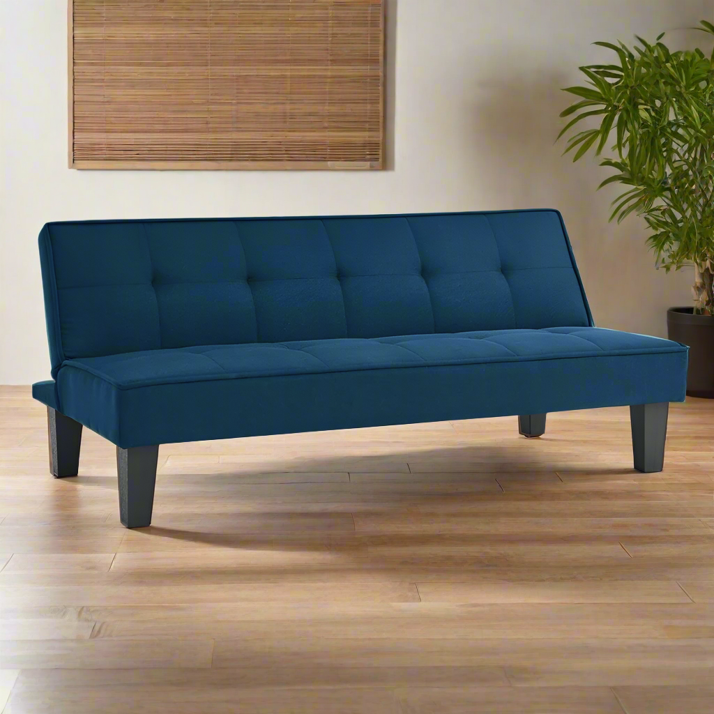 Blue sofabed with tufted backrest, padded seat, and four dark wooden legs