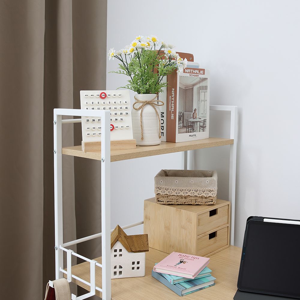 White desk with natural wood shelves and open storage, styled with books and decor