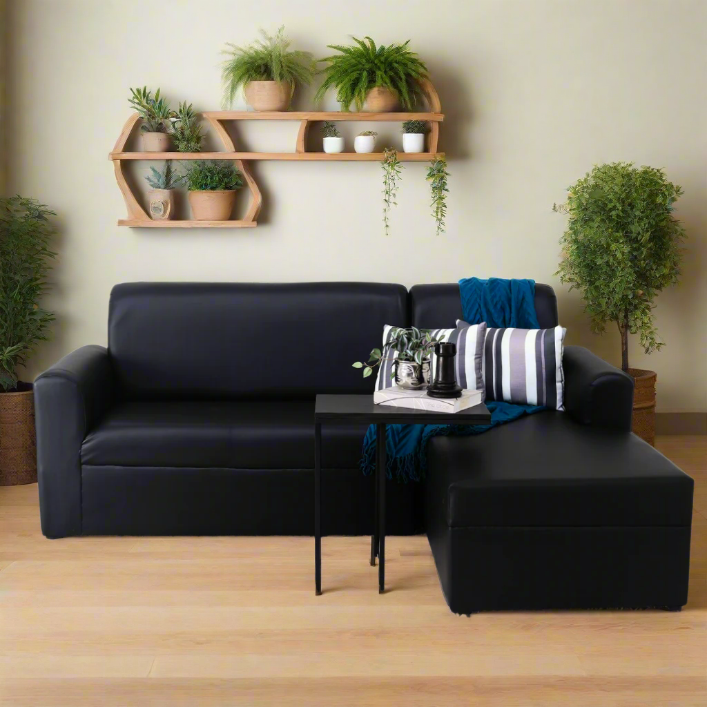Black L-shape sofa with blue throw and striped pillows