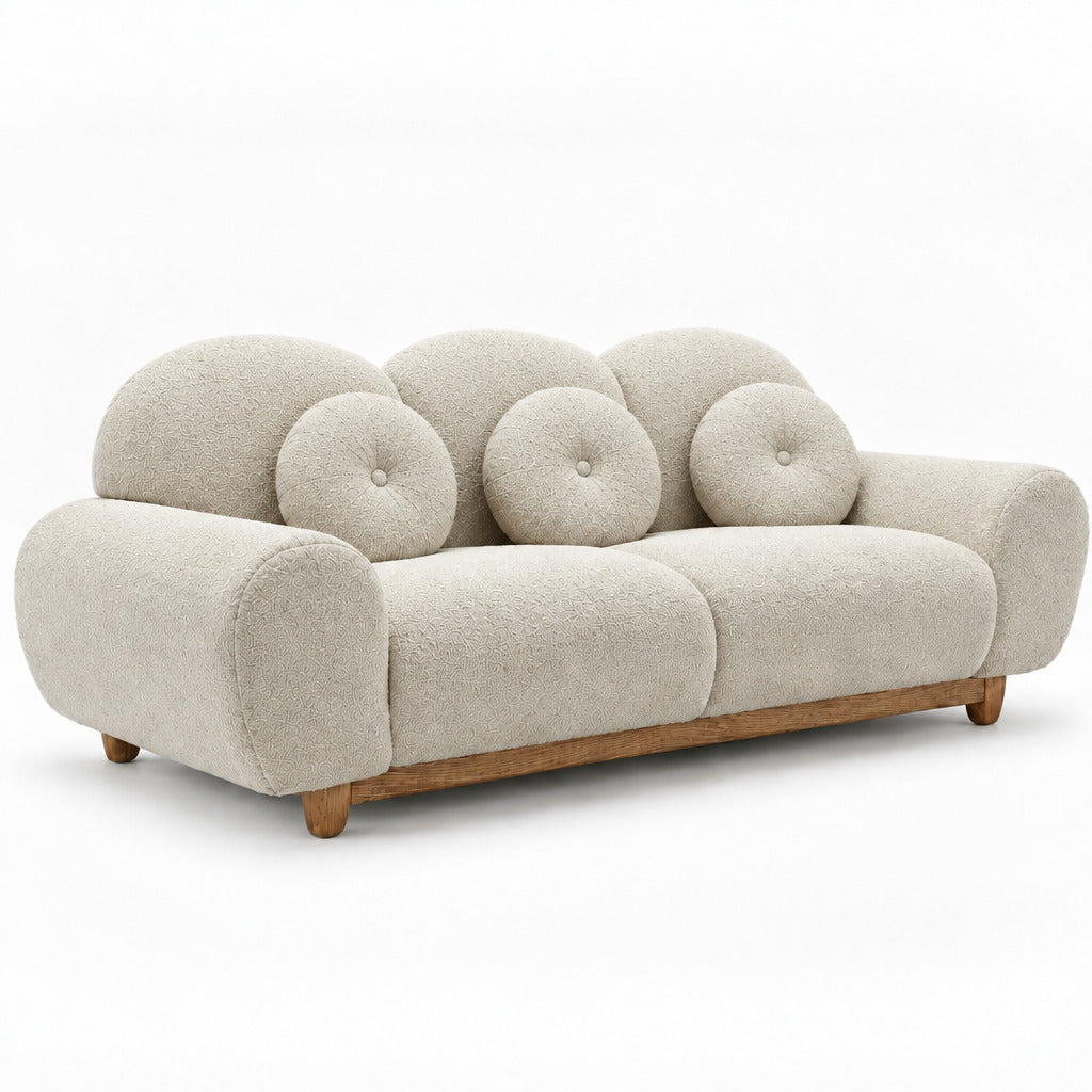 3-seater sofa in light beige with rounded arms, tufted back cushions, wooden legs
