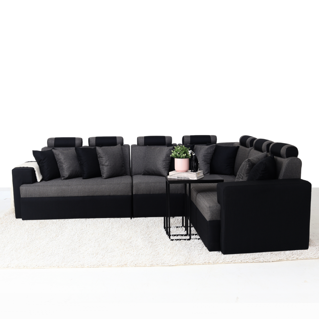L-shape sectional sofa in gray and black with chaise section and accent pillows