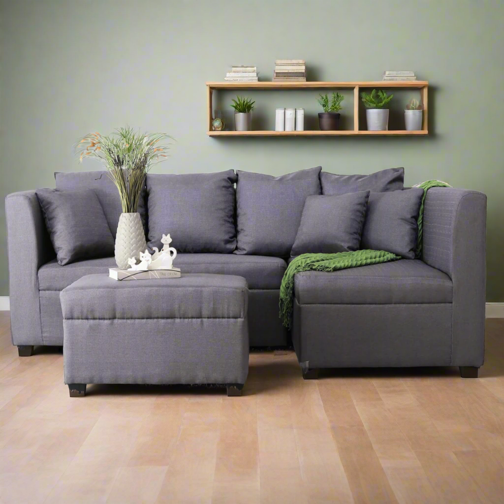 Gray L-shape sofa with chaise ottoman, three back cushions, and dark legs