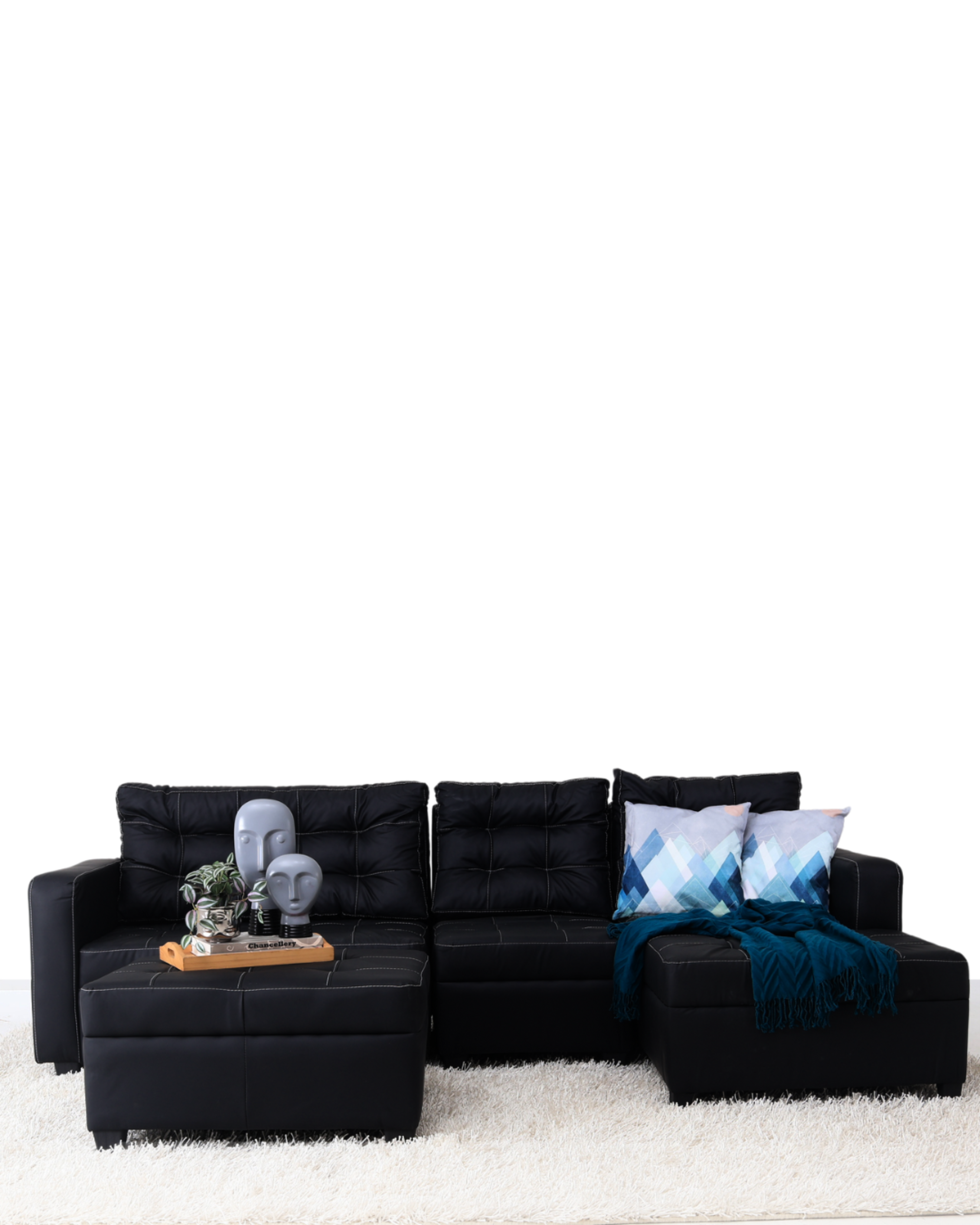 Black L-shape sofa with tufted upholstery and built-in corner chaise with ottoman