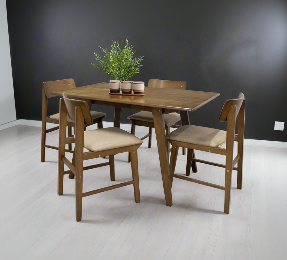 Dining room table set for four with four wooden chairs, beige cushions, and cups
