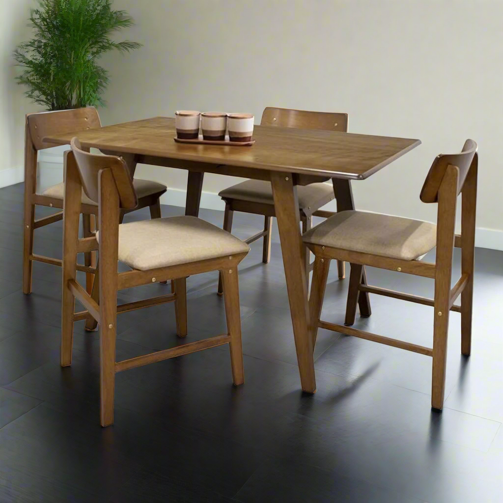 Wood dining table with four chairs and beige seat cushions, table set with cups