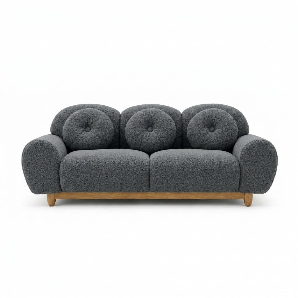 3-seater sofa with dark gray tufted back and rounded arms, wooden legs