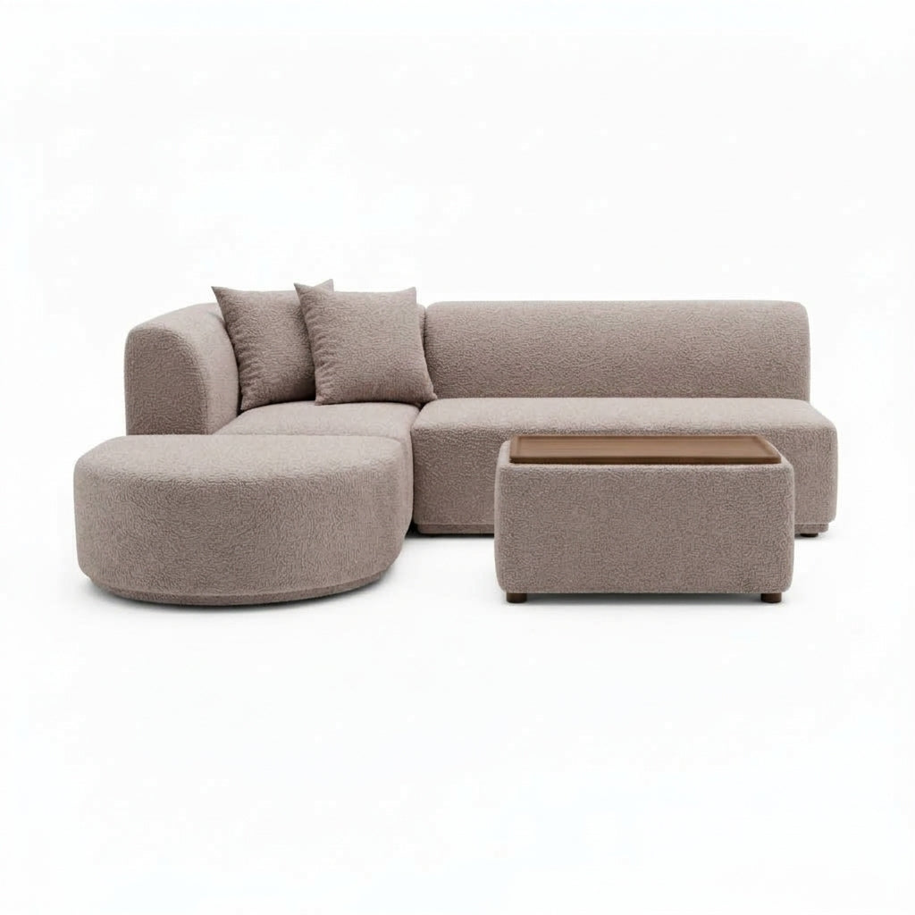 Beige mini modular sofa with rounded chaise and matching storage ottoman