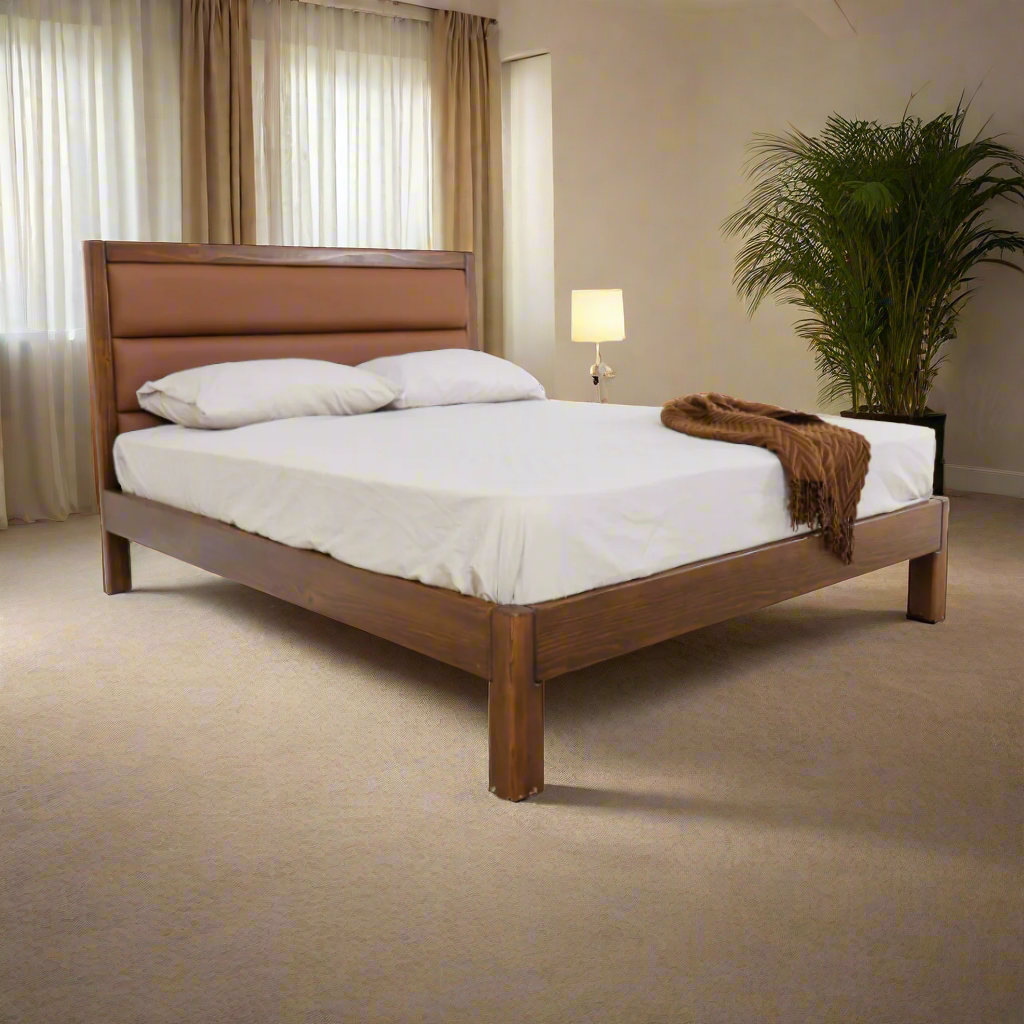 Brown wood bed frame with headboard, footboard, and white mattress
