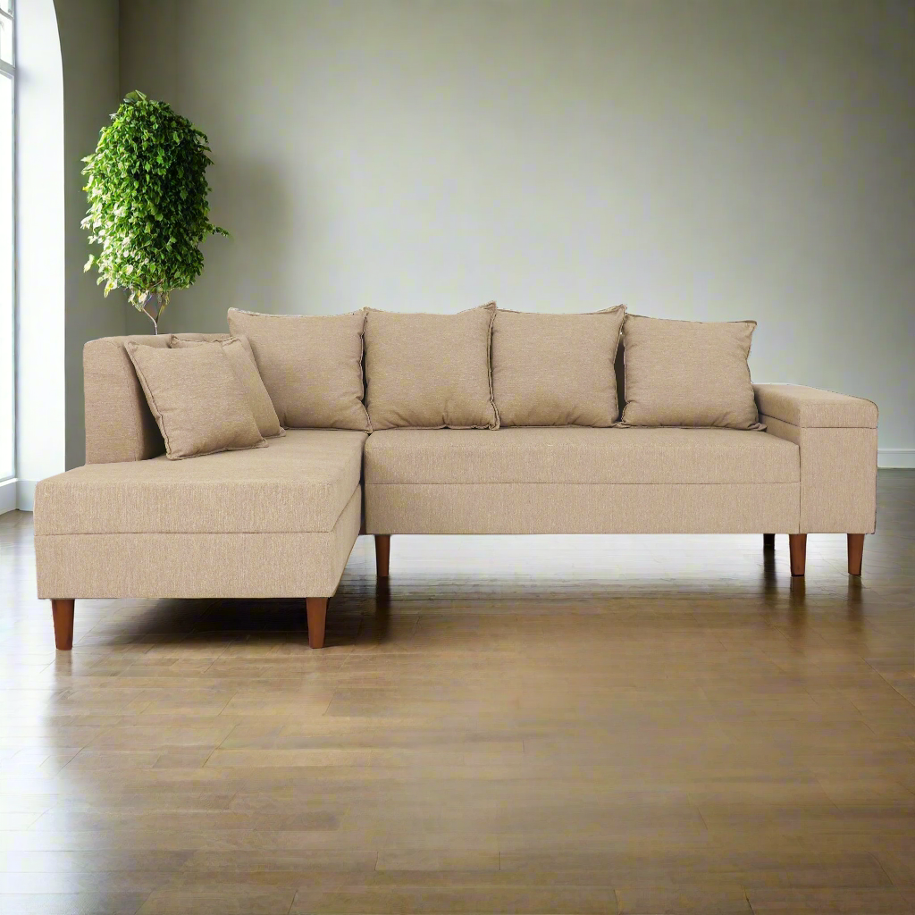 Beige L-shaped sofa with left chaise, four back cushions and matching throw pillows
