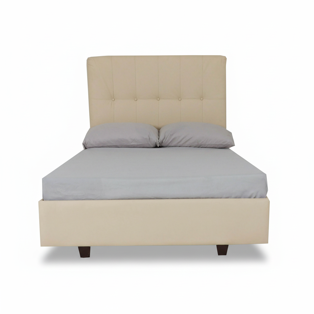 Beige single bed with tufted headboard and grey bedding, padded base, short legs