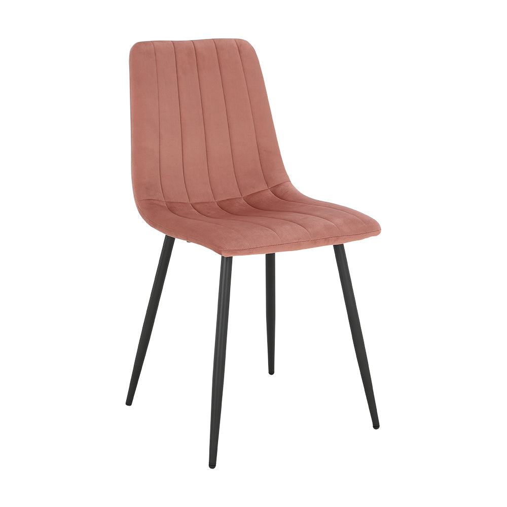 Pink upholstered dining chair with curved back, vertical stitched channels, and black legs