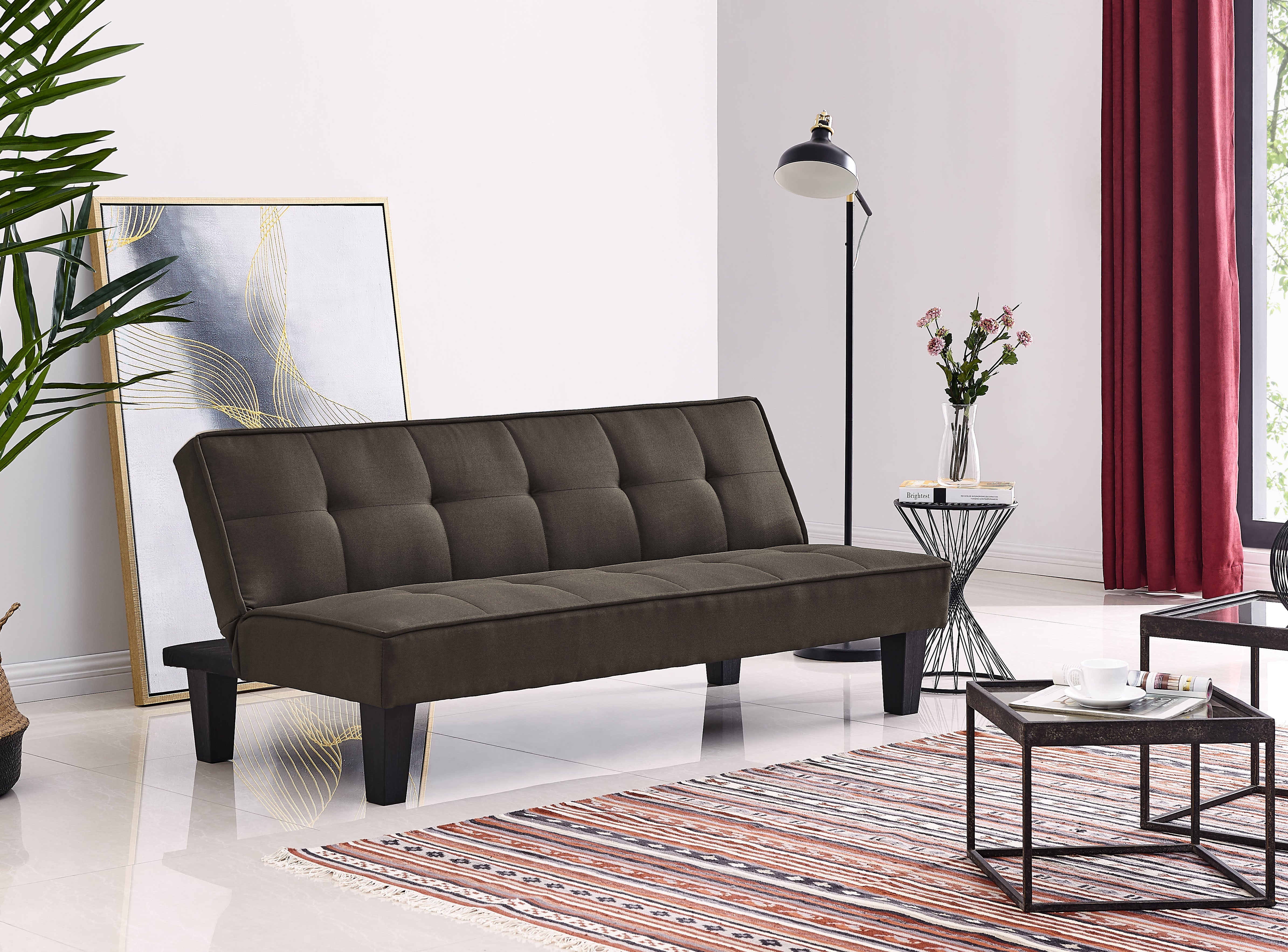 Brown sofa bed with tufted backrest and padded seat, dark wooden legs