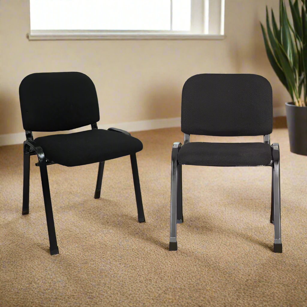 Set of 2 black visitors chairs with padded seats and backs on metal legs