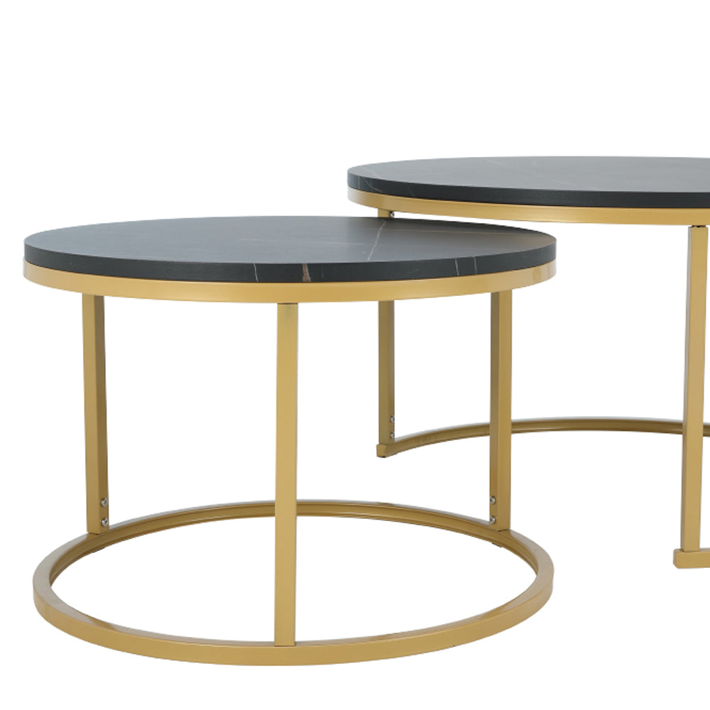 Round nesting side table with dark gray marble-look top and gold curved base