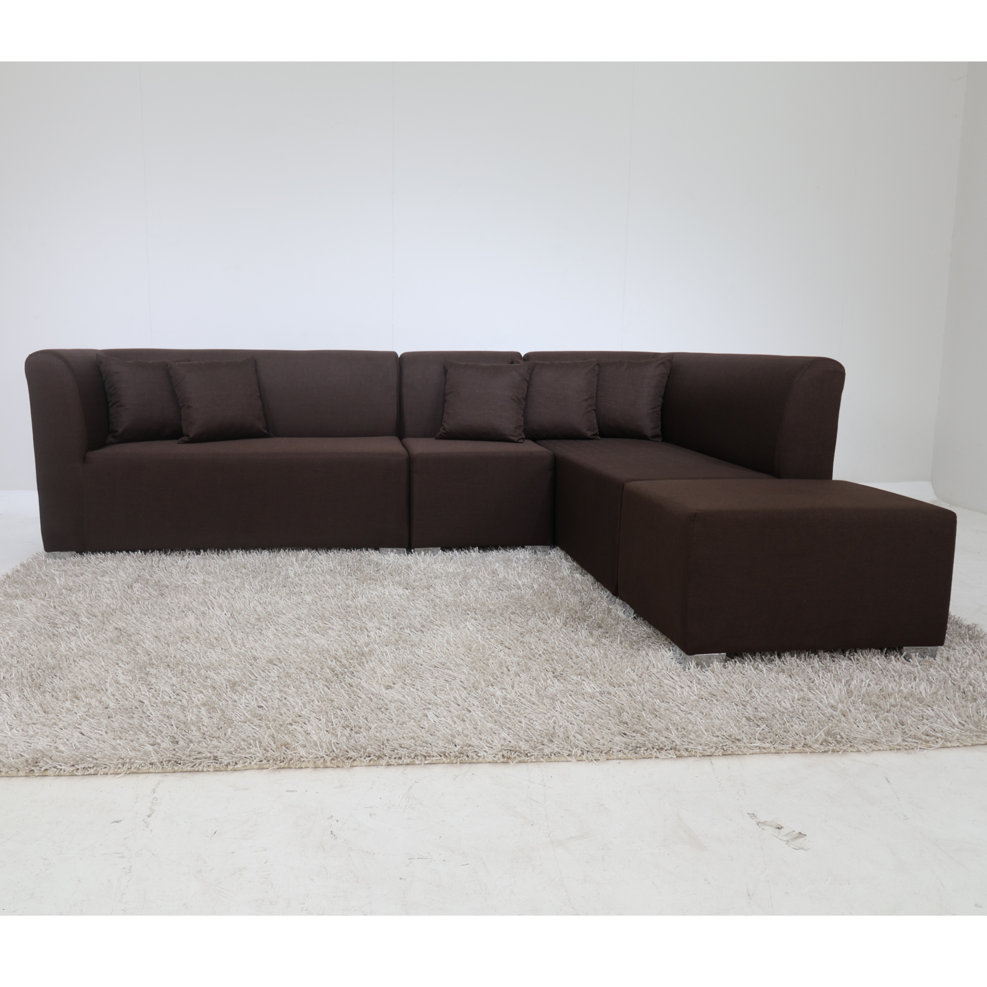 Dark brown L-shape sectional sofa with long chaise and rectangular ottoman