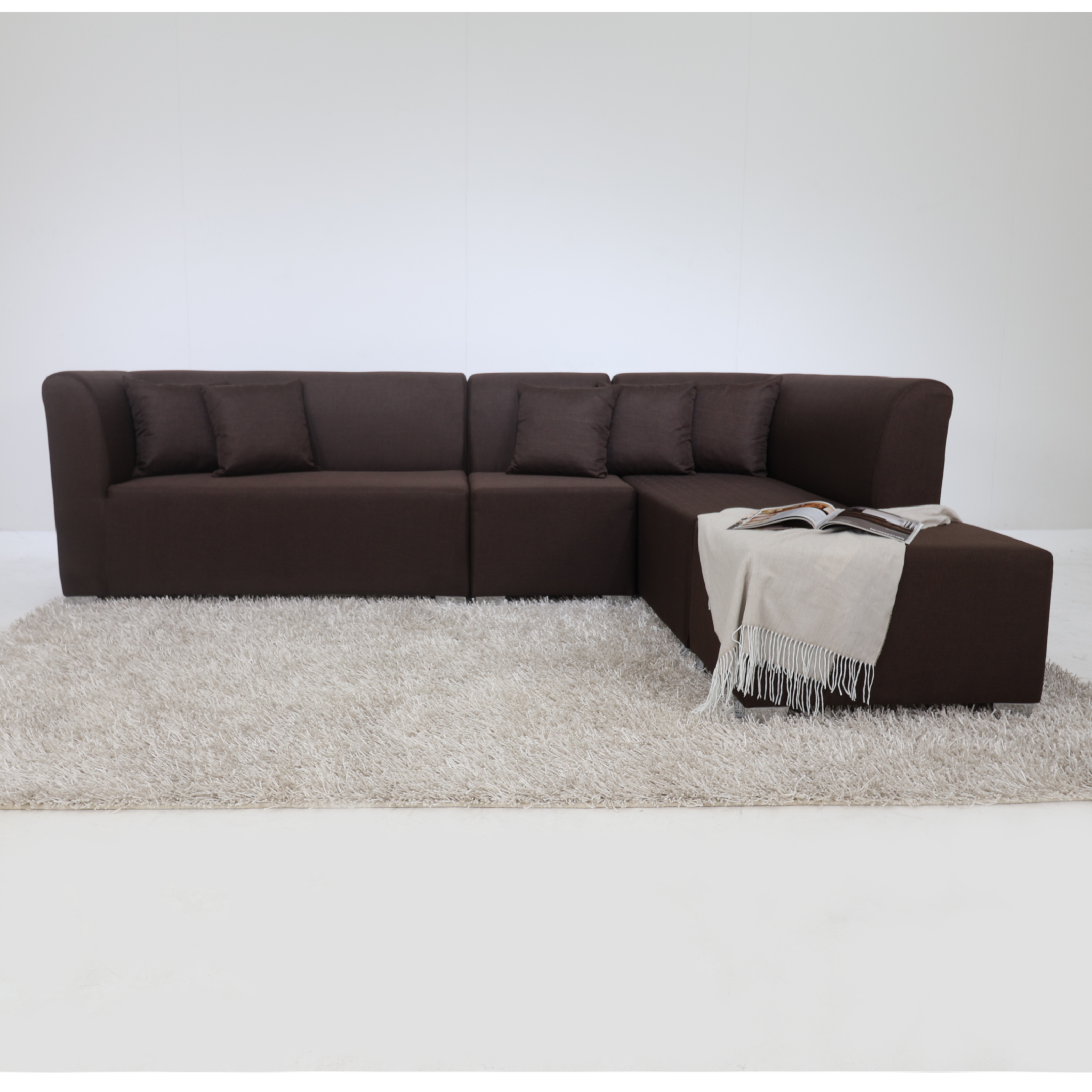 Dark brown L-shape sectional sofa with cushioned back and center ottoman
