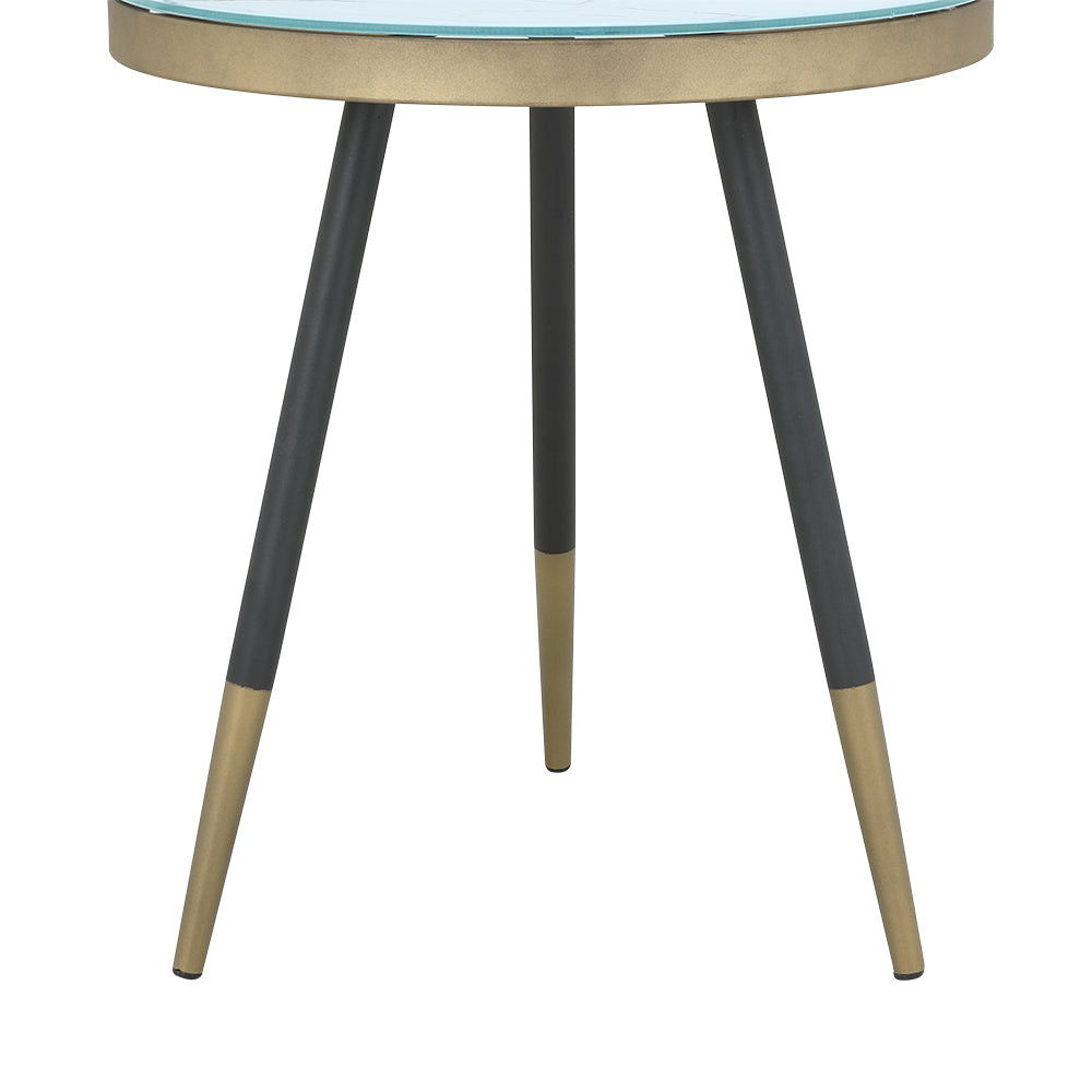 Olive side table with dark tapered legs and light accents beneath round glass top