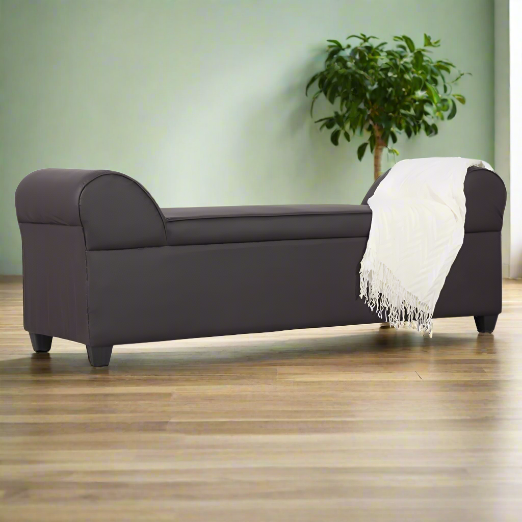 Lounge sofa with rounded arms, dark upholstery, and white throw blanket on right side