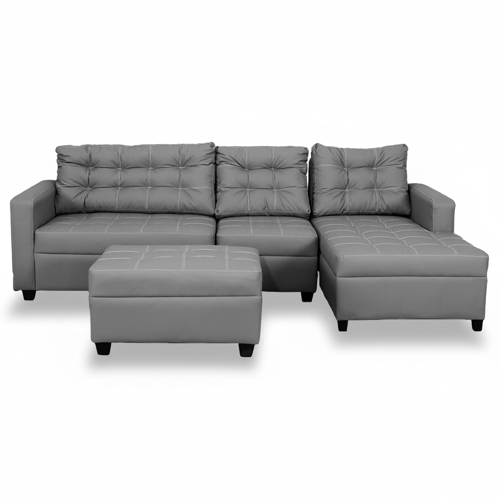 Gray L-shape sofa with tufted seat cushions, chaise section, and matching square ottoman.