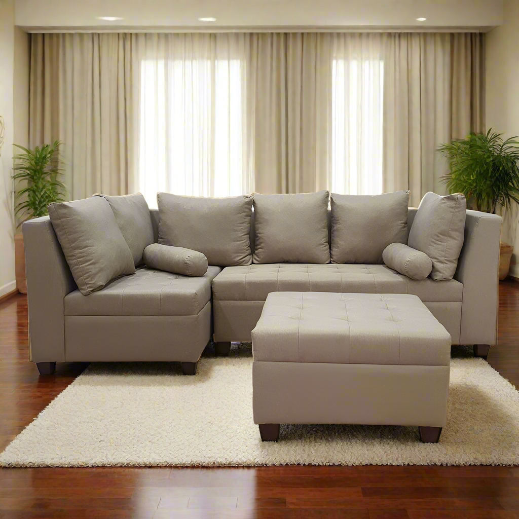 Light beige L-shape sofa with chaise ottoman, seat cushions, and pillows