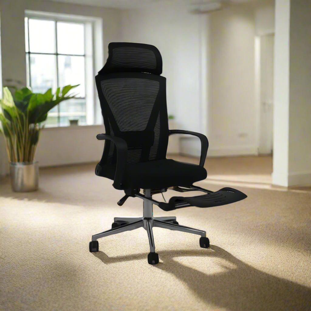 Black executive office chair with mesh back and footrest, padded seat, and rolling base.