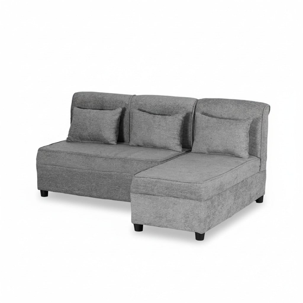 Grey L-shape sofa with chaise extension, three back pillows and dark legs