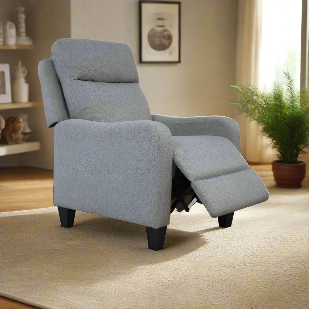 Light grey recliner chair with reclined seat and hinged footrest