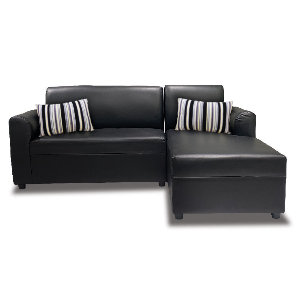 Black L-shape sofa with two striped pillows on backrest
