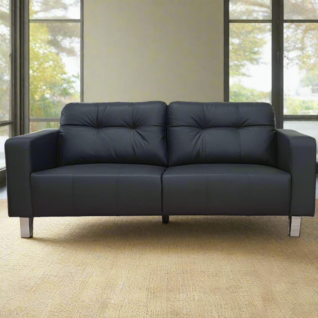 3-seater sofa front view with tufted back and padded arms in dark upholstery