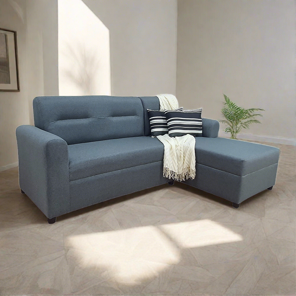 Blue-gray L-shape sofa with cushions and black-and-white striped pillows