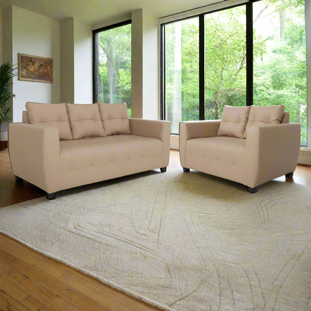 Beige 3-seat sofa with tufted upholstery, boxy arms, and dark legs