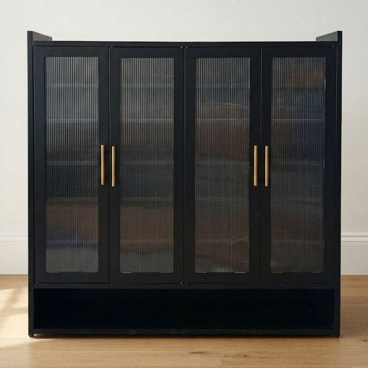 Black four-door shoe cabinet with ribbed glass panels and gold-tone handles