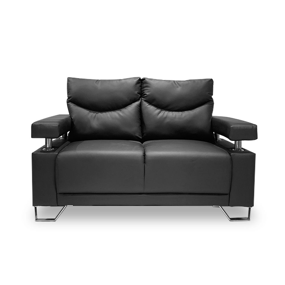Compact dark sofa with quilted back cushions, armrests, and chrome legs