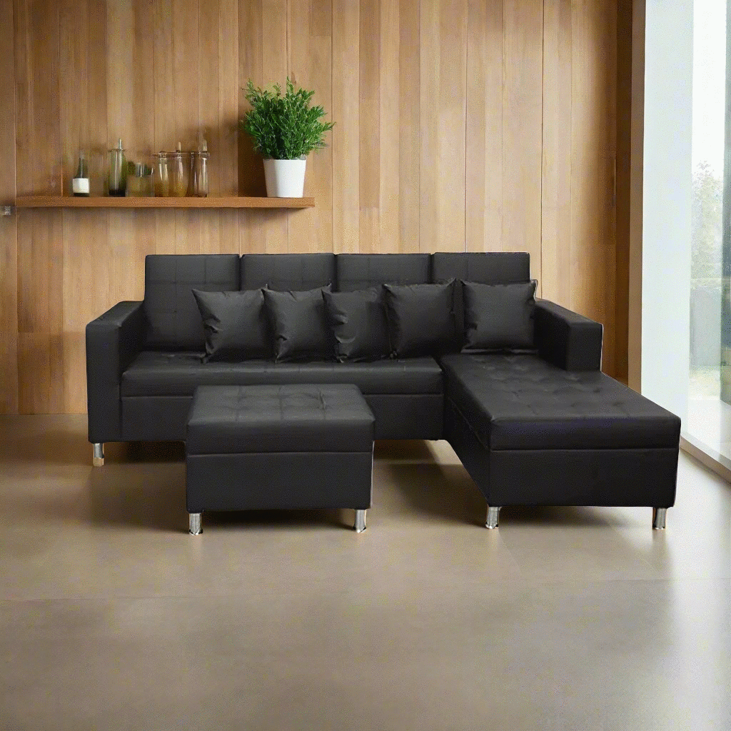 Dark L-shape upholstered sofa with tufted back cushions and ottoman chaise