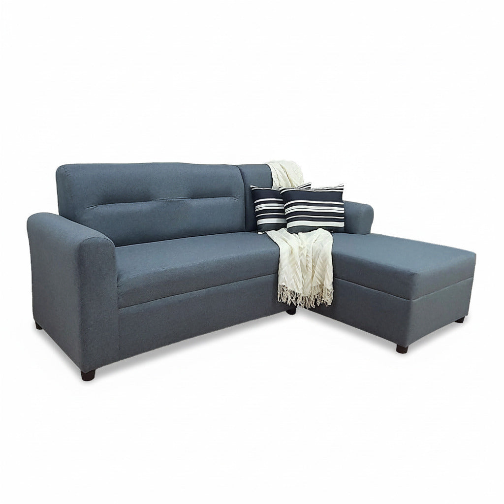Dark gray L-shape sofa with striped pillows and throw blanket