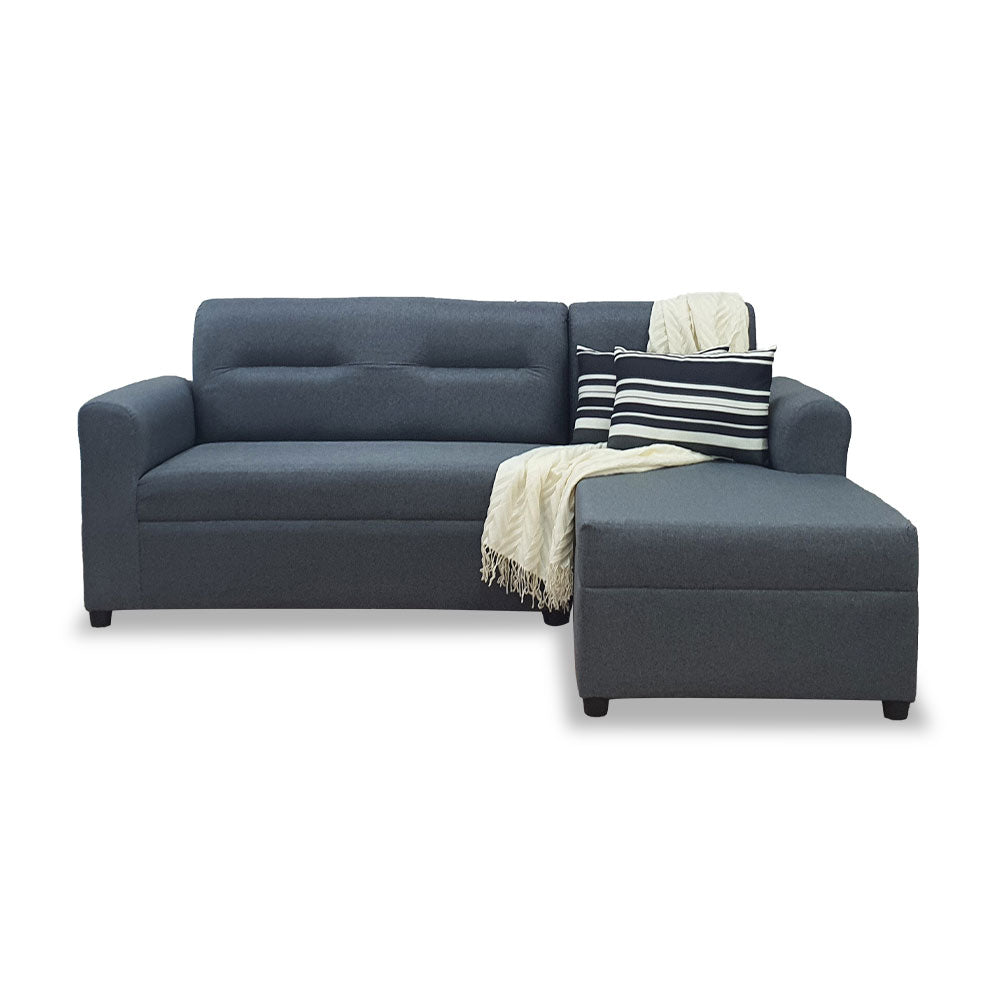 Dark gray L-shape sofa with striped and light pillows