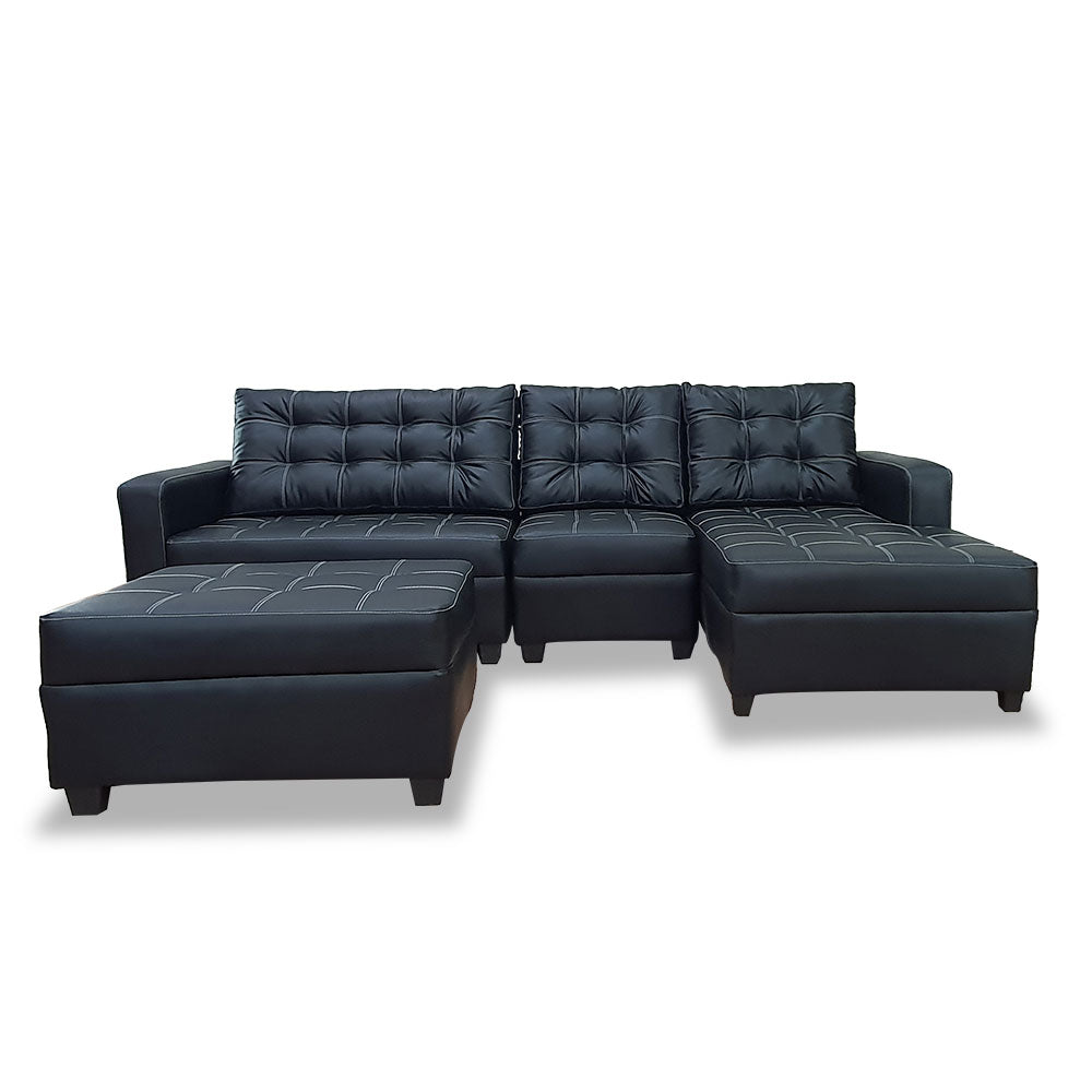 Dark navy L-shape sofa with tufted cushions and two matching ottomans