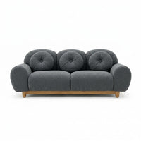 3-seater sofa with dark gray tufted back and rounded arms, wooden legs