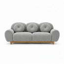 3-seater sofa with light gray tufted back, rounded arms, and wooden legs