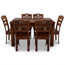 Wooden dining table set with six chairs on a white background