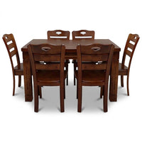 Wooden dining table set with six chairs on a white background