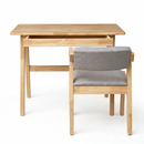 Natural wood study desk with open shelf and side chair; gray upholstered backrest