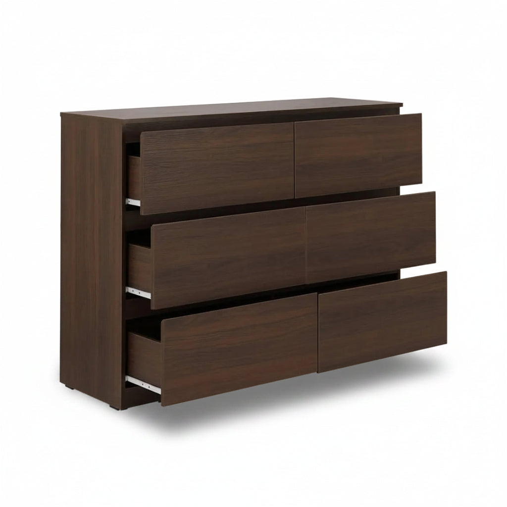 Wooden dresser with four drawers on a white background