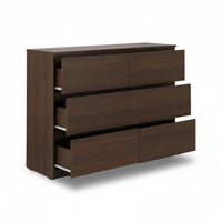 Wooden dresser with four drawers on a white background