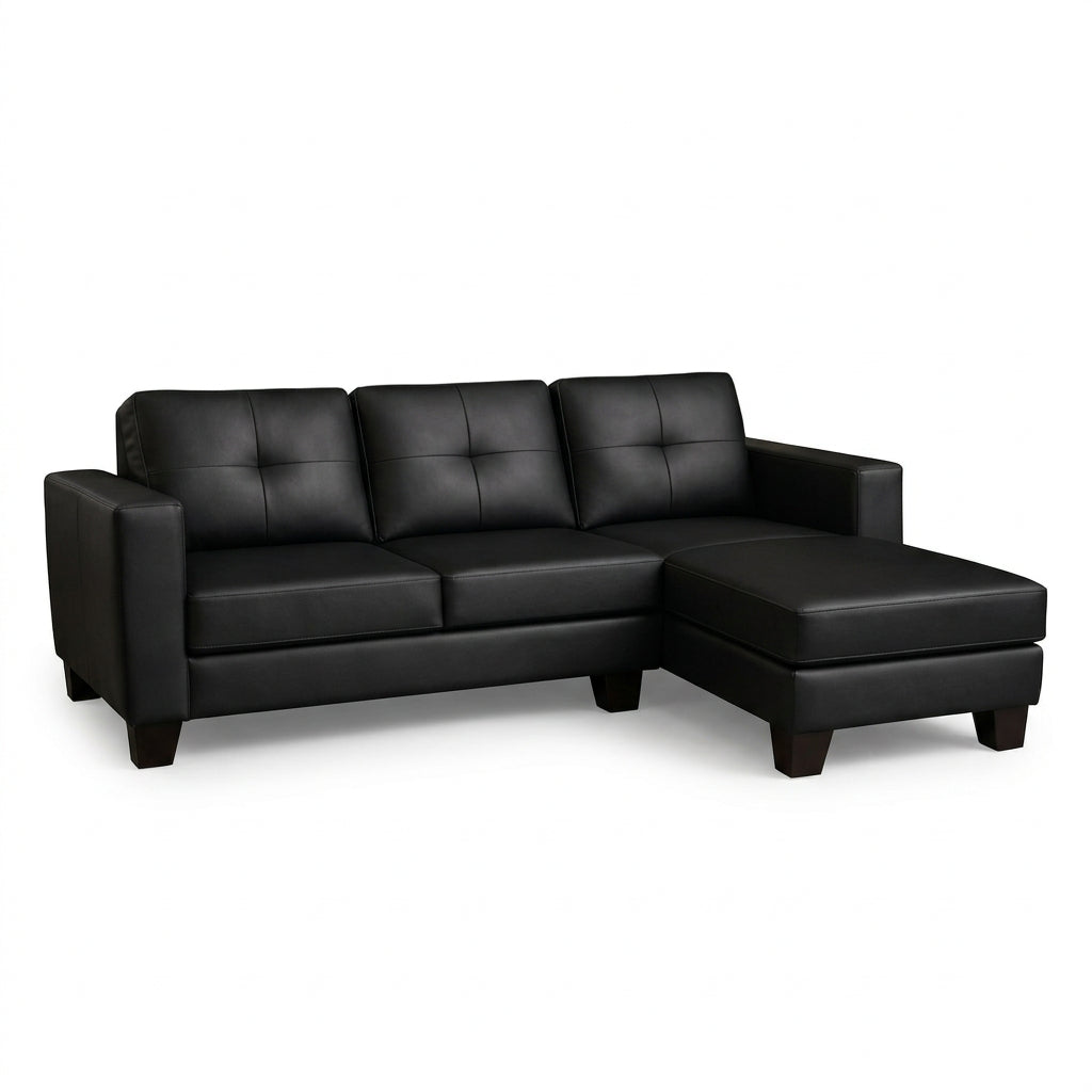 Black L-shape sectional sofa with padded armrests, tufted back cushions, chaise seat