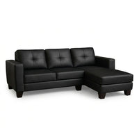 Black L-shape sectional sofa with padded armrests, tufted back cushions, chaise seat