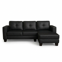 Black L-shaped sectional sofa with three back cushions and right chaise, track arms