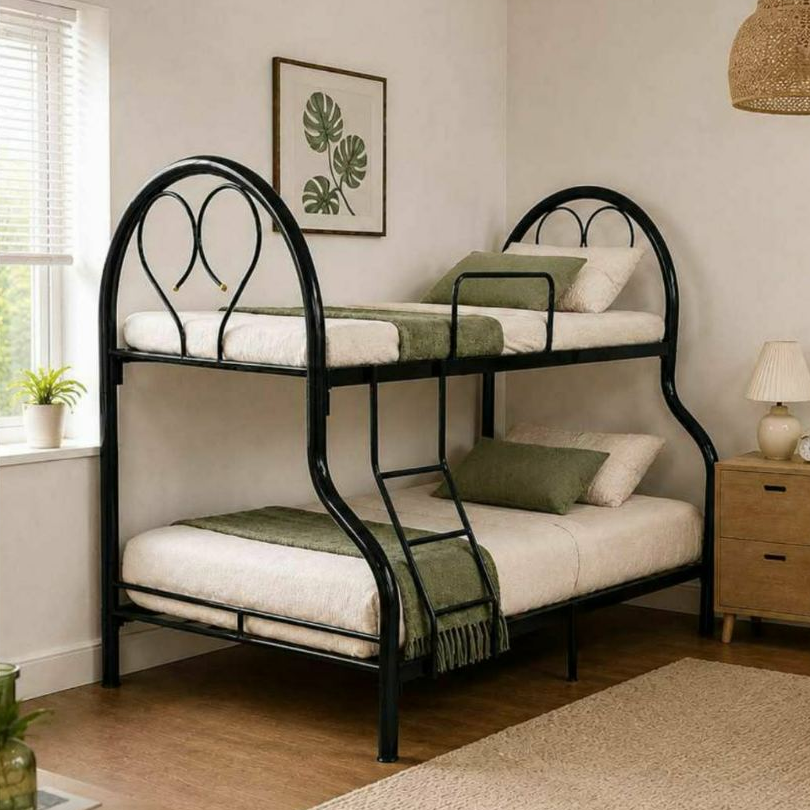 Double bunk bed with black metal frame, white mattresses, green pillows and throw