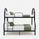 Double bunk bed with black rails, white bedding, green pillows and runner on lower bunk