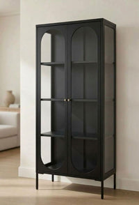 JIRAH black display cabinet with arched glass doors, shelves, and slim legs
